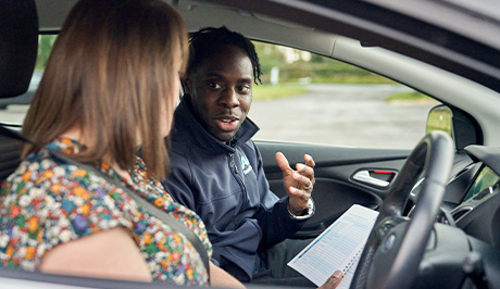 woman and man sitting in car