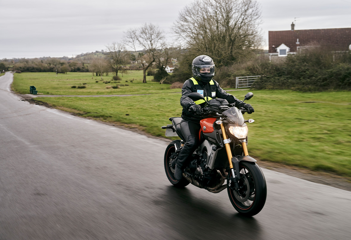 Female rider on open road